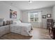 Bright bedroom featuring a large window and natural light, creating a relaxing atmosphere at 3103 Oliver Stanley Trl, Lancaster, SC 29720