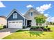 Attractive home with well-maintained landscaping, two-car garage, and a welcoming entrance at 3103 Oliver Stanley Trl, Lancaster, SC 29720