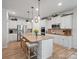 Bright kitchen with stainless steel appliances, a center island, and stylish pendant lighting at 3103 Oliver Stanley Trl, Lancaster, SC 29720