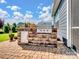 Paver patio featuring a built-in outdoor kitchen with a stainless steel grill, ideal for outdoor cooking at 3103 Oliver Stanley Trl, Lancaster, SC 29720