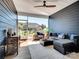 Comfortable screened-in patio featuring stylish furniture, a ceiling fan, and views of the backyard at 3103 Oliver Stanley Trl, Lancaster, SC 29720