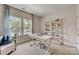 Bright home office showcases a stylish desk, comfortable chair, and shelving for an organized workspace at 3124 Stelfox St, Charlotte, NC 28262