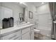 Clean bathroom showcases a white vanity, modern fixtures, and a combined shower-tub, offering style and functionality at 3128 Stelfox St, Charlotte, NC 28262