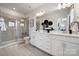Large bathroom with a double vanity, walk-in shower and modern fixtures at 3128 Stelfox St, Charlotte, NC 28262