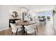 Open concept dining area with a round table and bright kitchen in the background at 3128 Stelfox St, Charlotte, NC 28262