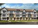 Modern townhome exterior showcasing multi-tone brick, vertical siding and inviting entryways at 3128 Stelfox St, Charlotte, NC 28262