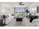 Bright living room featuring a comfortable sectional sofa, modern decor, and large windows at 3128 Stelfox St, Charlotte, NC 28262