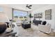 Sunlit living room showcases a large window, comfortable seating, and modern decor at 3128 Stelfox St, Charlotte, NC 28262