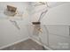Walk-in closet with hanging racks, shelving, and ample storage space at 3128 Stelfox St, Charlotte, NC 28262