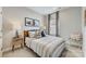Comfortable bedroom with neutral tones, decorative pillows, side tables, and natural light at 3132 Stelfox St, Charlotte, NC 28262