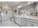 Bright, large main bathroom boasts dual sinks, a glass shower and ample counter space at 3132 Stelfox St, Charlotte, NC 28262