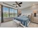 Comfortable main bedroom features a large window, tray ceiling, and coordinated furnishings at 3132 Stelfox St, Charlotte, NC 28262