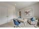 Well-appointed office space features a desk, chair, and a modern butterfly art piece at 3132 Stelfox St, Charlotte, NC 28262