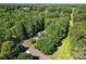 Secluded home nestled among mature trees offering lots of privacy on a sprawling lot at 335 Bob White Run, Salisbury, NC 28147
