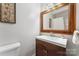This bathroom features a wood vanity and framed mirror at 335 Bob White Run, Salisbury, NC 28147