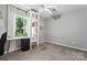 This bedroom has neutral carpet, a ceiling fan, and built-in shelving at 335 Bob White Run, Salisbury, NC 28147
