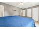 This bedroom features light grey walls, a ceiling fan, and wood flooring at 335 Bob White Run, Salisbury, NC 28147
