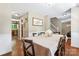 Dining room with hardwood floors, large table, and doorway to the kitchen area at 335 Bob White Run, Salisbury, NC 28147