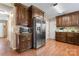 Well-lit kitchen featuring stainless steel appliances, granite countertops, and dark wood cabinetry at 335 Bob White Run, Salisbury, NC 28147