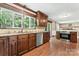 Well-lit kitchen with custom wood cabinetry, granite countertops, and stainless steel appliances at 335 Bob White Run, Salisbury, NC 28147