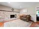 Inviting living room with a stone fireplace, hardwood floors, and neutral-toned walls at 335 Bob White Run, Salisbury, NC 28147