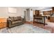 Comfortable living room featuring hardwood floors and an open floor plan to kitchen and dining at 335 Bob White Run, Salisbury, NC 28147