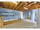 Unfinished basement provides ample storage and direct access to the backyard at 3828 Delgany Dr, Charlotte, NC 28215