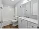 Updated bathroom with a shower-tub combo and modern vanity at 3828 Delgany Dr, Charlotte, NC 28215