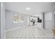 Open floor plan featuring tile flooring, white kitchen cabinets, and stainless steel appliances at 3828 Delgany Dr, Charlotte, NC 28215