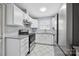 Updated kitchen features white cabinetry, granite countertops, and modern appliances at 3828 Delgany Dr, Charlotte, NC 28215