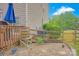 The backyard features a wooden deck and a rock garden separated by a rustic wooden fence at 3864 Meadow Ridge Nw Dr, Concord, NC 28027