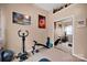 Bedroom featuring exercise equipment, neutral paint, and ample natural light and mirrored closet at 3864 Meadow Ridge Nw Dr, Concord, NC 28027