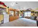 Spacious bonus room with custom display cabinets, track lighting, and ample natural light at 3864 Meadow Ridge Nw Dr, Concord, NC 28027