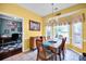 Charming dining room featuring a wooden table set, bay window, and adjacent office space at 3864 Meadow Ridge Nw Dr, Concord, NC 28027