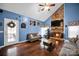Living room featuring hardwood floors, vaulted ceiling, stone fireplace, and abundant natural light at 3864 Meadow Ridge Nw Dr, Concord, NC 28027