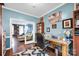 Stylish home office with a glass-top desk, comfortable chair, and views into the adjacent living room at 3864 Meadow Ridge Nw Dr, Concord, NC 28027