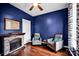 Cozy sitting room featuring a stone fireplace, hardwood floors, and comfortable seating with accent pillows at 3864 Meadow Ridge Nw Dr, Concord, NC 28027
