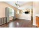 Cozy dining area adjacent to kitchen features wood flooring at 4002 Solomons Ct, Monroe, NC 28110