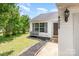 Charming home exterior with well-manicured lawn, featuring a bench and lovely landscaping at 4002 Solomons Ct, Monroe, NC 28110