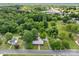 Aerial view of a charming home nestled among mature trees with a view of the surrounding community at 402 School St, Rockwell, NC 28138