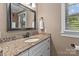 Bathroom vanity with granite countertops and a modern faucet at 402 School St, Rockwell, NC 28138