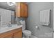 Bathroom with a wood vanity and light grey walls at 402 School St, Rockwell, NC 28138