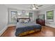 Inviting bedroom with natural light, hardwood floors, and warm decor at 402 School St, Rockwell, NC 28138