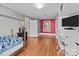 Bedroom with hardwood floors and closet and window at 402 School St, Rockwell, NC 28138