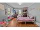 Bedroom with hardwood floors and windows, toys and a bookshelf at 402 School St, Rockwell, NC 28138