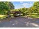 Carport featuring parking for a boat and car with additional storage on a well-maintained lot at 402 School St, Rockwell, NC 28138