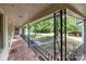 View from the front porch, showcasing decorative wrought iron railings and the view of the spacious front yard at 402 School St, Rockwell, NC 28138