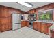 Well-equipped kitchen features custom cabinets, stainless steel appliances, and granite countertops at 402 School St, Rockwell, NC 28138