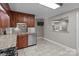 Cozy kitchen with granite countertops, stainless steel dishwasher, and a view to the other rooms at 402 School St, Rockwell, NC 28138