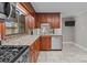 Galley kitchen features stainless steel appliances, granite countertops, and ample cabinet space at 402 School St, Rockwell, NC 28138